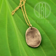 Child's molded fingerprint necklace