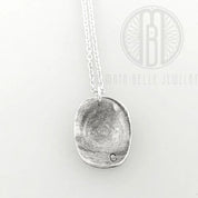 Child's molded fingerprint necklace